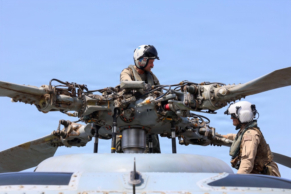 John Finn Conducts Flight Quarters [Image 3 of 3] - DVIDS