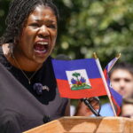 Dozens rally at Boston City Hall Plaza to urge passage of bill extending TPS for Haitians - WGBH