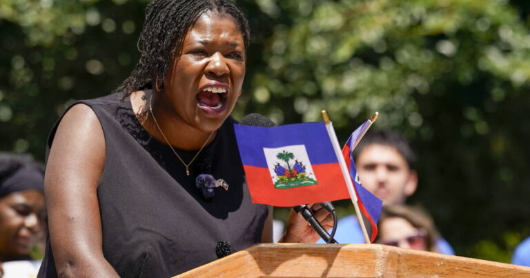 Dozens rally at Boston City Hall Plaza to urge passage of bill extending TPS for Haitians - WGBH
