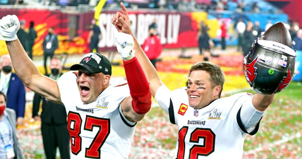 Feb 7, 2021; Tampa, FL, USA; Tampa Bay Buccaneers quarterback Tom Brady (12) and tight end Rob Gronkowski (87) celebrate after beating the Kansas City Chiefs in Super Bowl LV at Raymond James Stadium. Mandatory Credit: Mark J. Rebilas-USA TOD - Roanoke Times