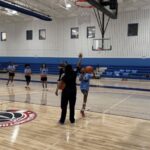 Local kids learn basketball skills at a camp with DC police officers - WTOP