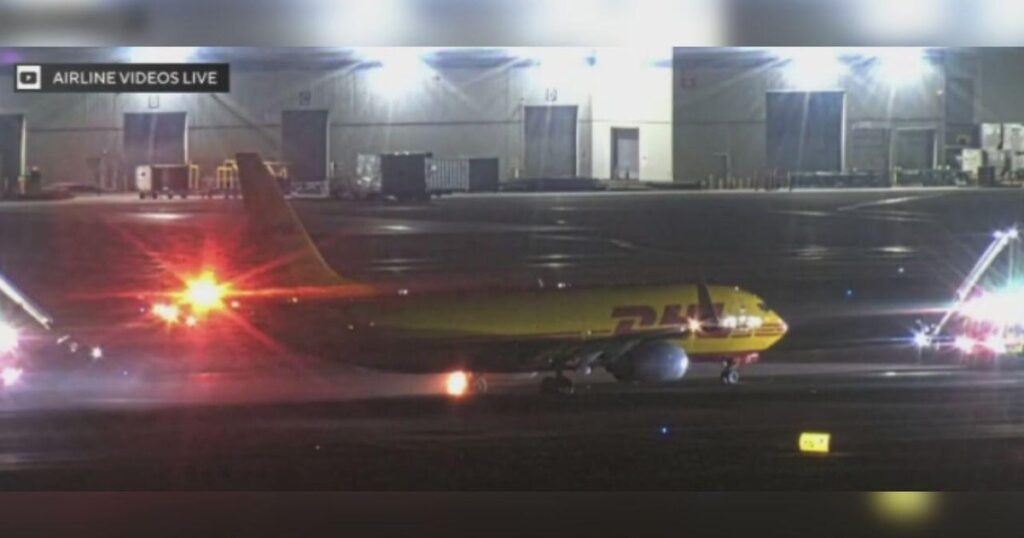 Video shows DHL cargo plane making fiery landing at LAX after experiencing issue with brake system - CBS News