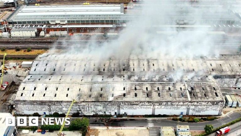 Huge waste facility fire shuts Tube and train lines - BBC