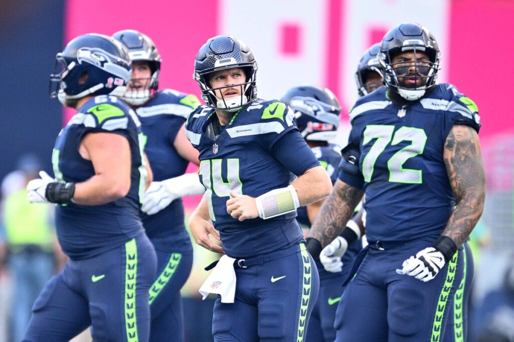 Sam Darnold injures hip on first drive of opener; Drew Lock, defense survive Patriots - The New York Times