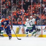 Paul Cotter scores in OT as the Canucks beat the Oilers 6-5 in the opener - michigansthumb.com
