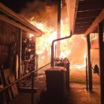 Wind-driven shed fire spreads to SE Portland home, 1 taken to hospital - KPTV