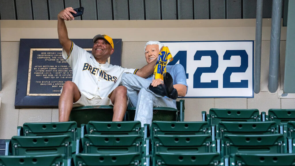 North Carolina fan visits Bob Uecker statue in upper deck at AmFam Field - Yahoo Sports